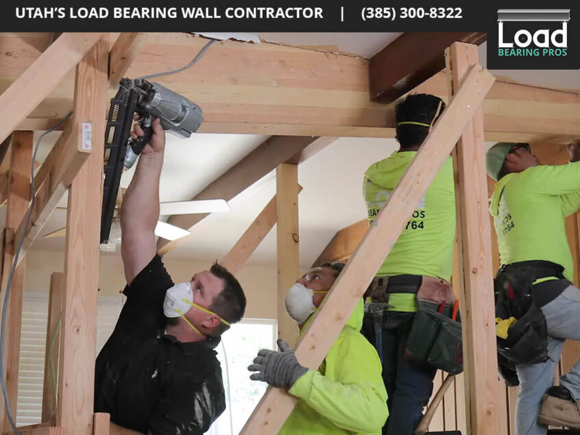 people installing a load bearing beam